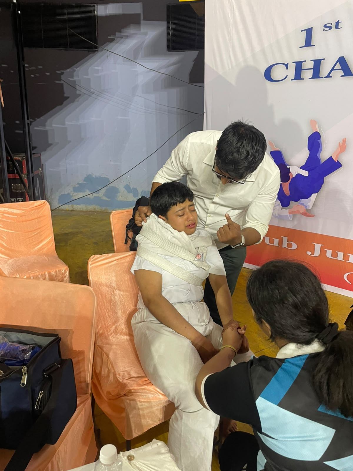 Dr. Sandeep assessing a young athlete on the field
